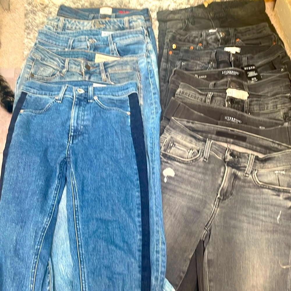 Several dozens of designer jeans. All colors, shades, styles. Sizes 24 to 26.